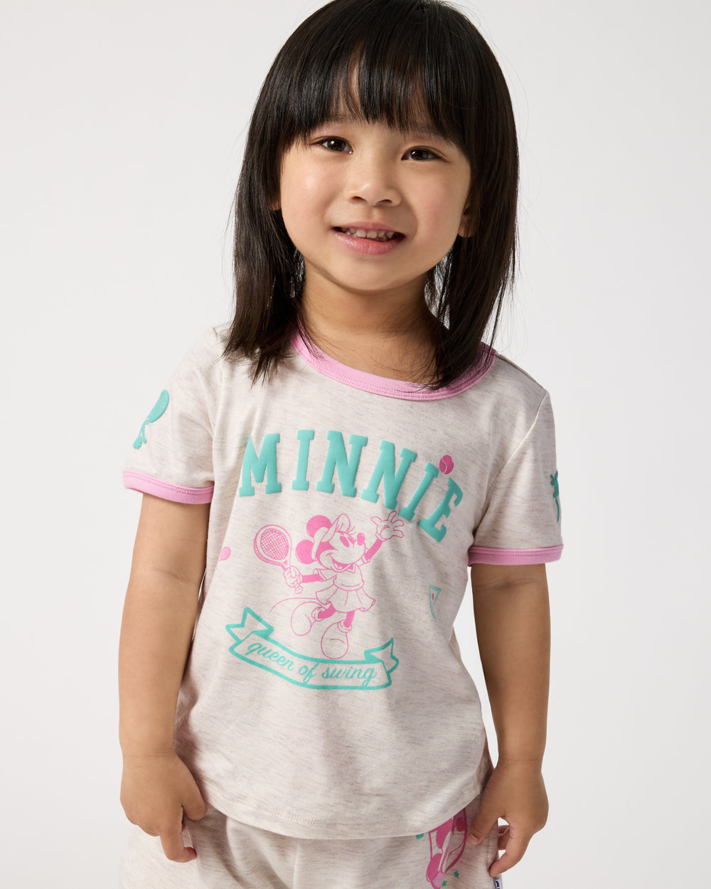 Front view of child wearing the Disney Minnie Mouse Queen of Swing Ringer Tee