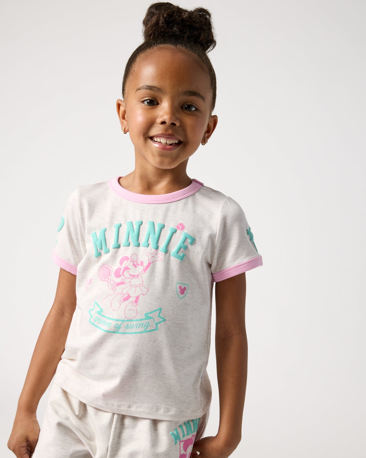 Girl wearing the Disney Minnie Mouse Queen of Swing Ringer Tee