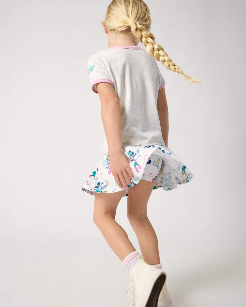 Child in motion wearing the Disney Mickey Mouse & Minnie Mouse Match Pleated Skort