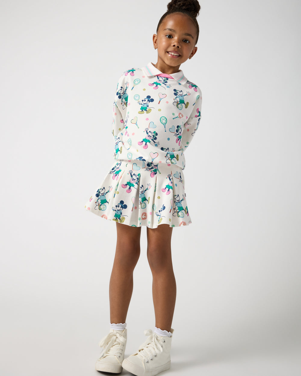 Girl wearing the Disney Mickey Mouse & Minnie Mouse Match Pleated Skort and Crewneck Sweatshirt
