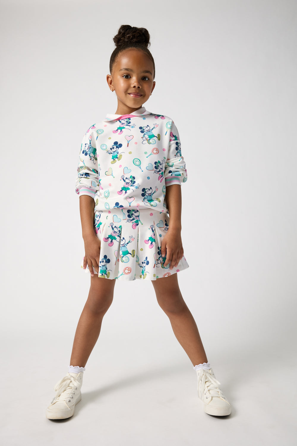 Girl wearing the Disney Mickey Mouse & Minnie Mouse Match Drop Shoulder Crewneck and Skort