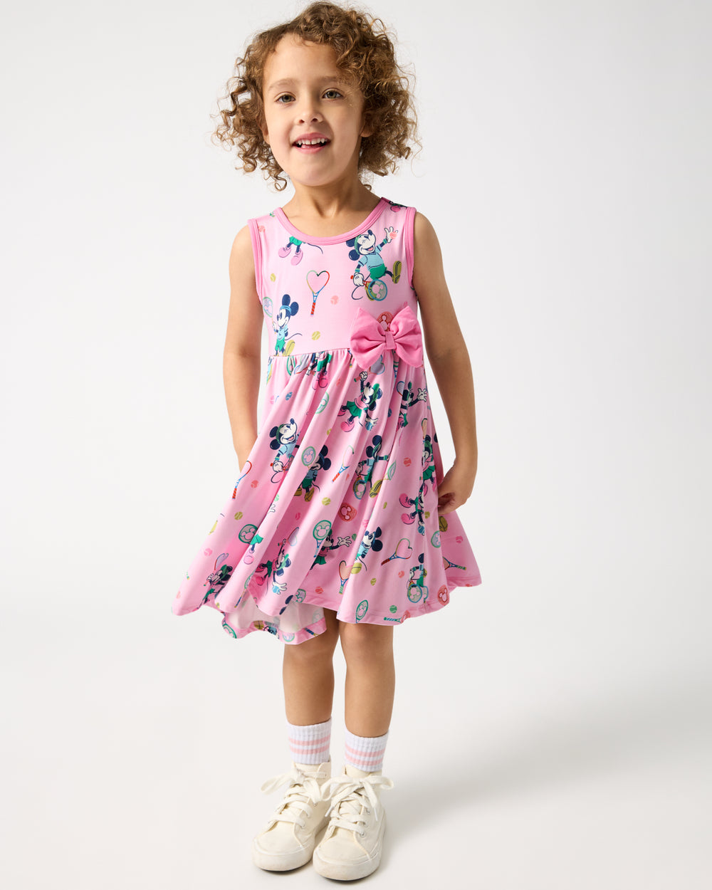 Standing girl wearing the Disney Mickey Mouse & Minnie Mouse Match Twirl Dress