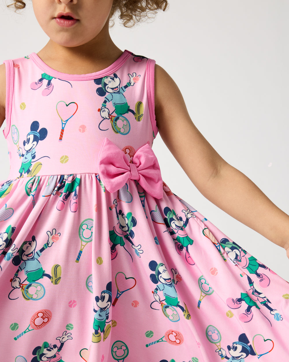 Close up of the bow detail on the Disney Mickey Mouse & Minnie Mouse Match Twirl Dress