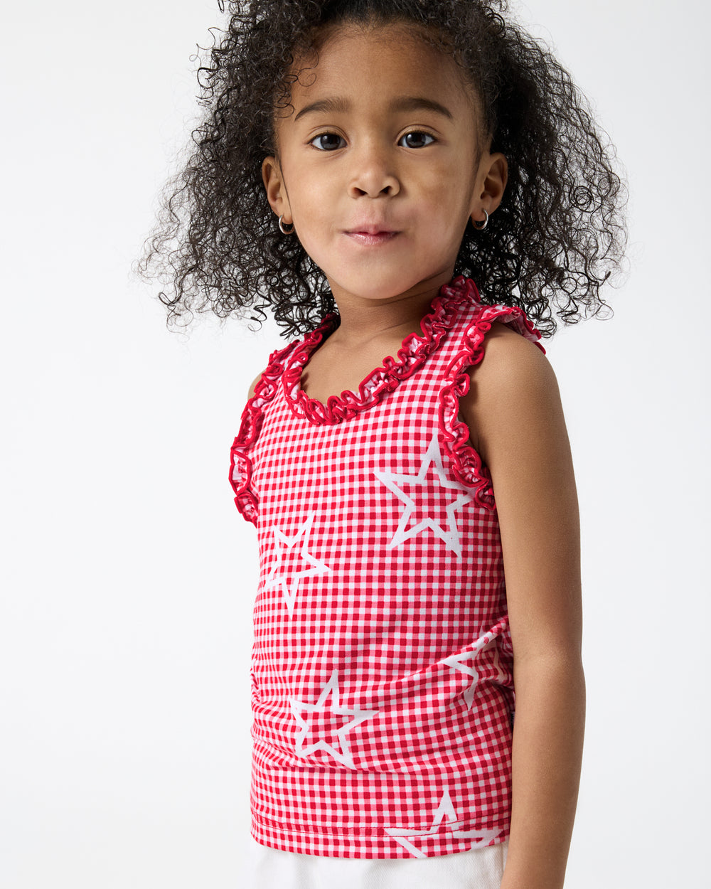 Close up of girl wearing the Celebration Gingham Ruffle Tank Top