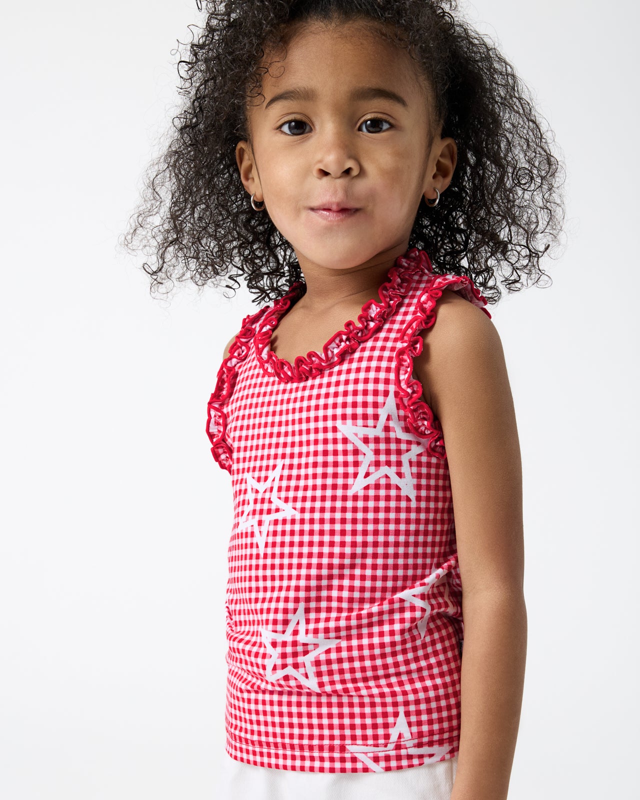 Close up of girl wearing the Celebration Gingham Ruffle Tank Top