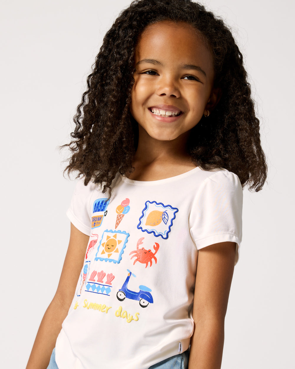 Close up of girl wearing the Ciao Bella Bow Back Puff Sleeve Tee