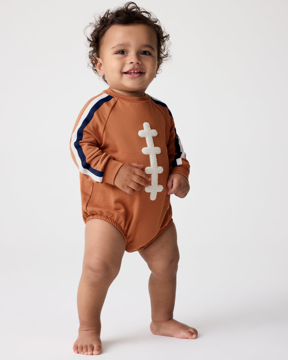 Baby wearing the Football Raglan Romper