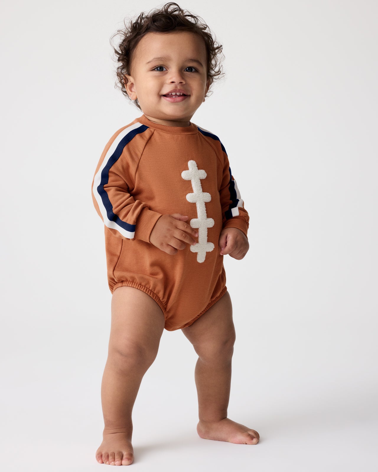 Baby wearing the Football Raglan Romper