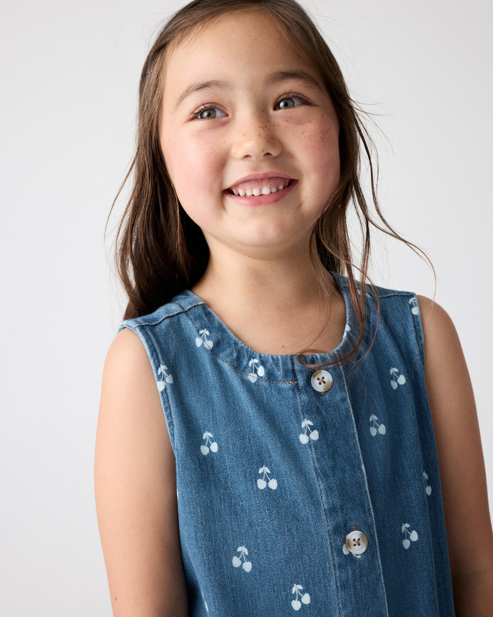 Close up of girl wearing the Cherry Button Down Dress