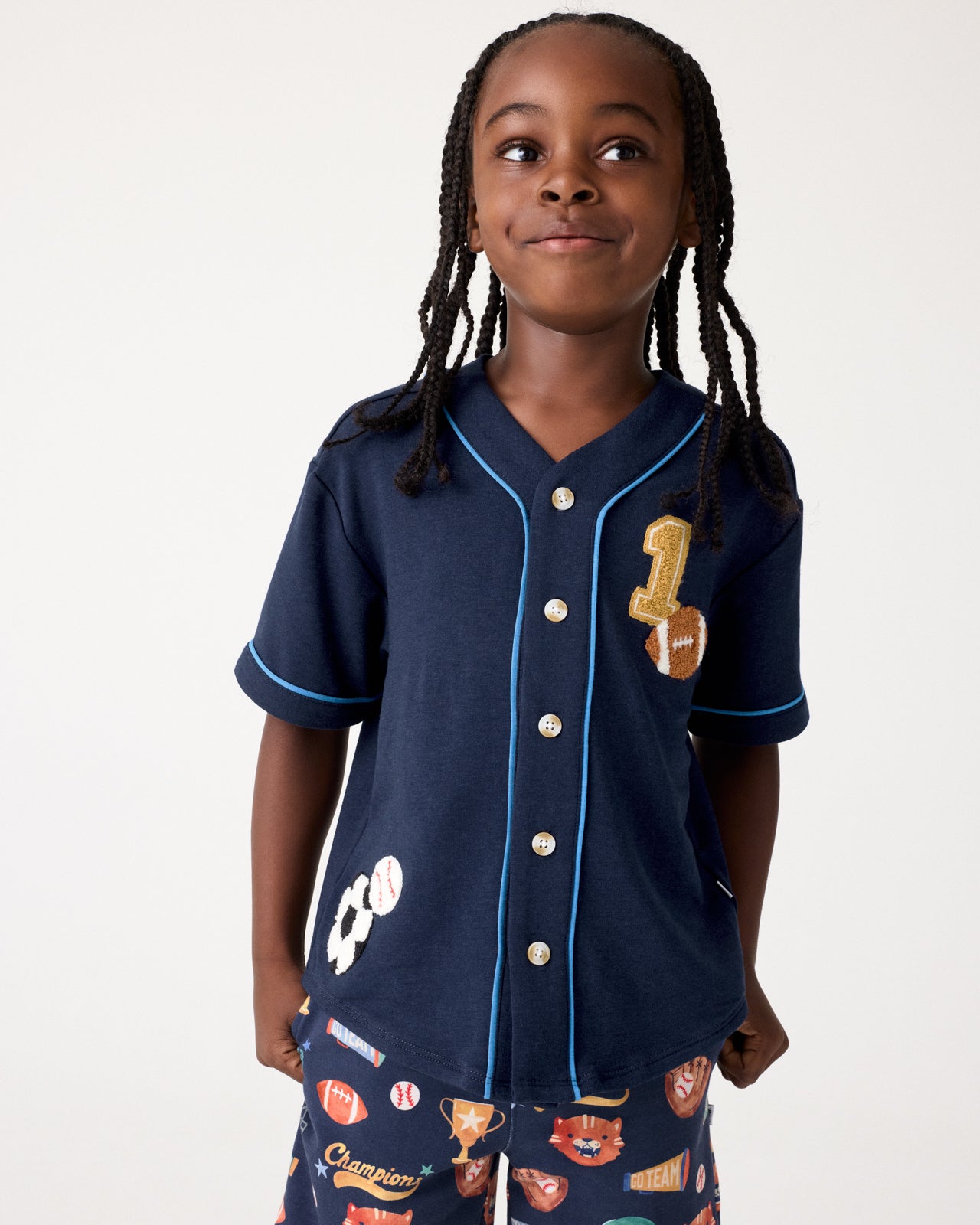 Boy wearing the Team Spirit Baseball Tee