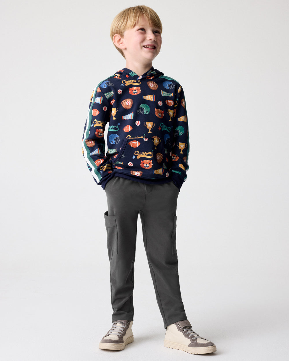 Boy wearing the Team Spirit Pullover Hoodie with Cargo Pants