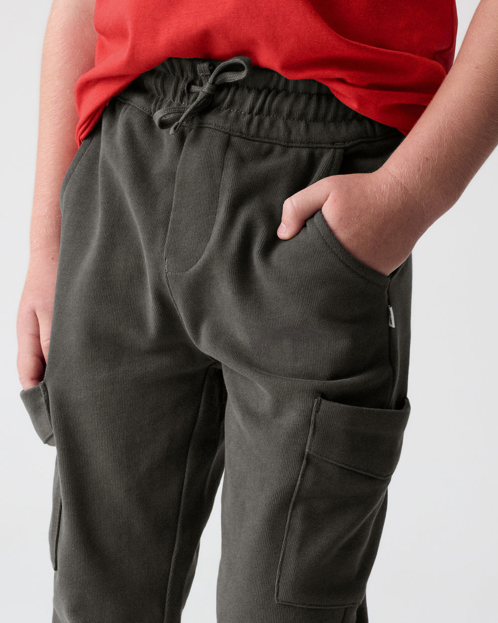 Boy wearing the Washed Black Cargo Pants with his hand in the pocket