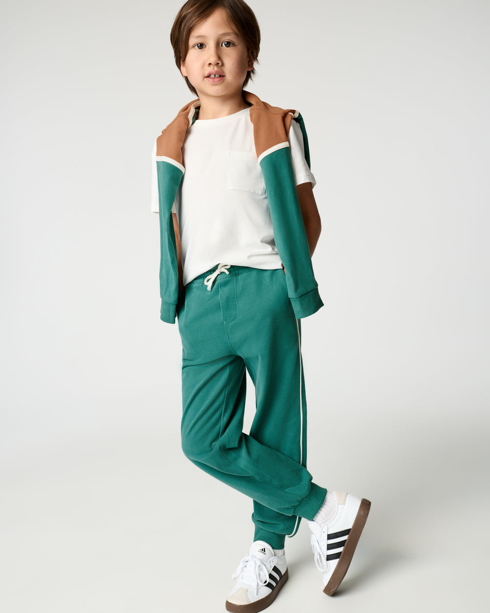 Boy wearing the Emerald Isle Relaxed Jogger with a white tee