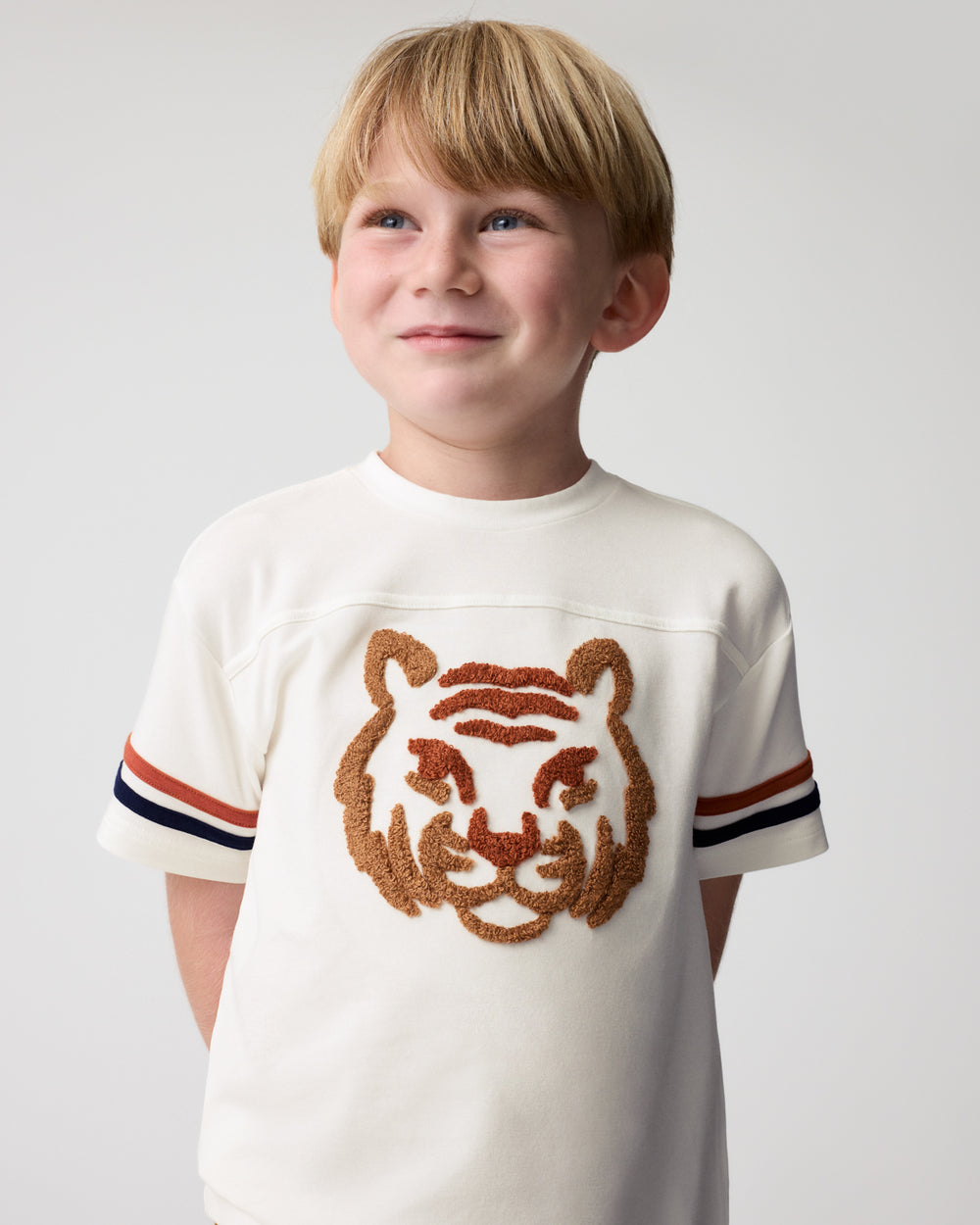 Close up of boy wearing the Brave Tiger Relaxed Tee