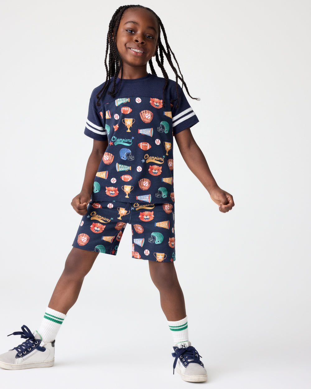 Boy wearing the Team Spirit Drawstring Shorts with a matching tee