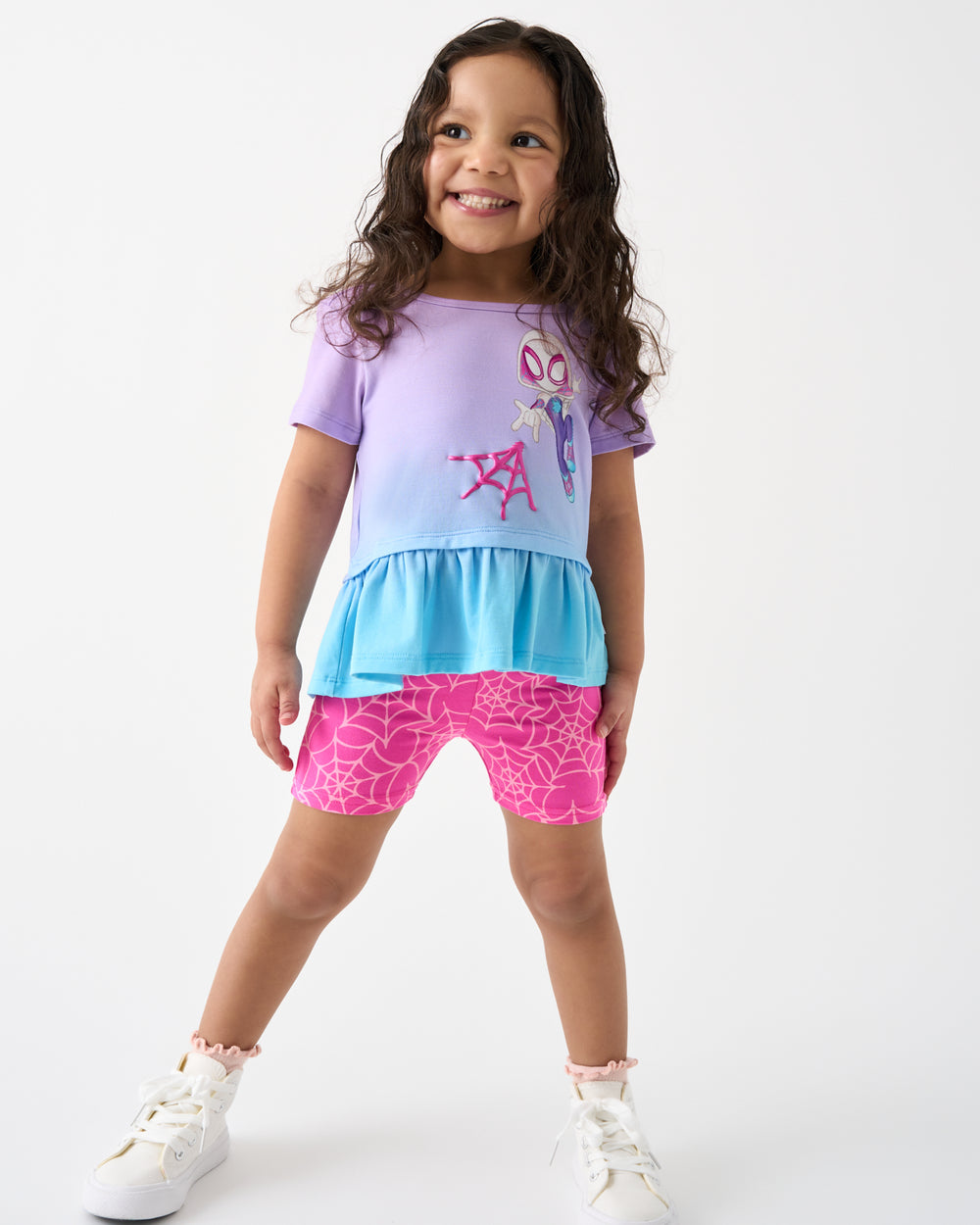Girl wearing the Spidey & Friends Ghost Spidey Peplum Top and Spidey Bike Shorts