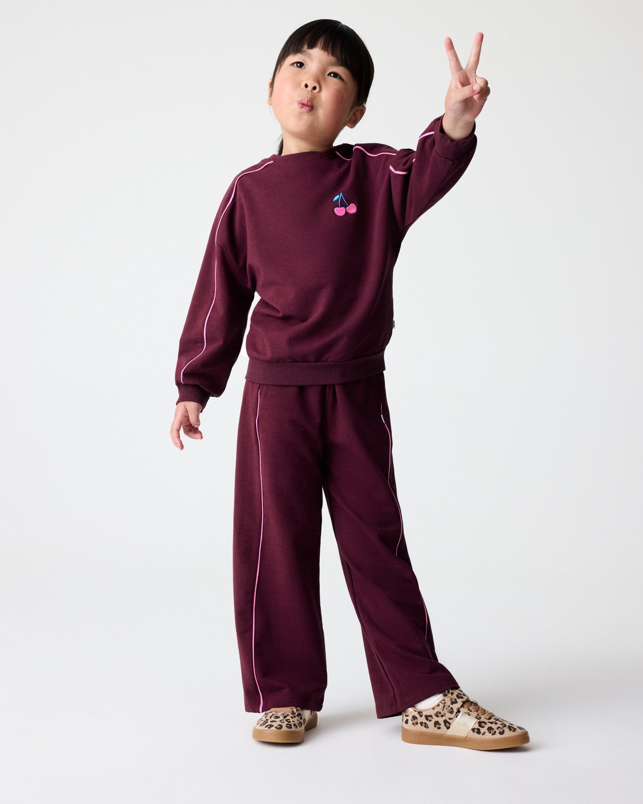 Girl wearing the Classic Burgundy Wide Leg Pant and Crewneck