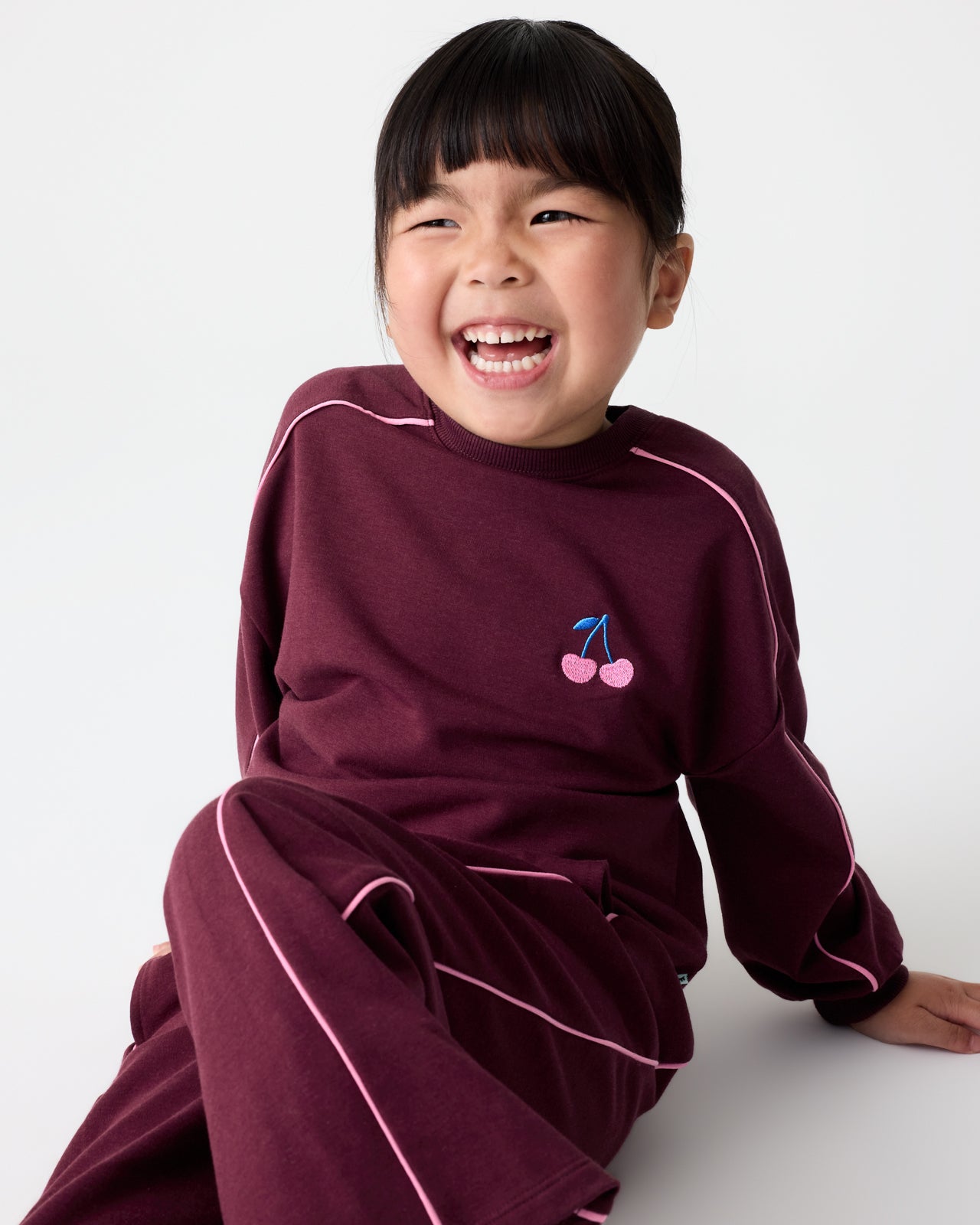 Girl wearing the Classic Burgundy Drop Shoulder Crewneck