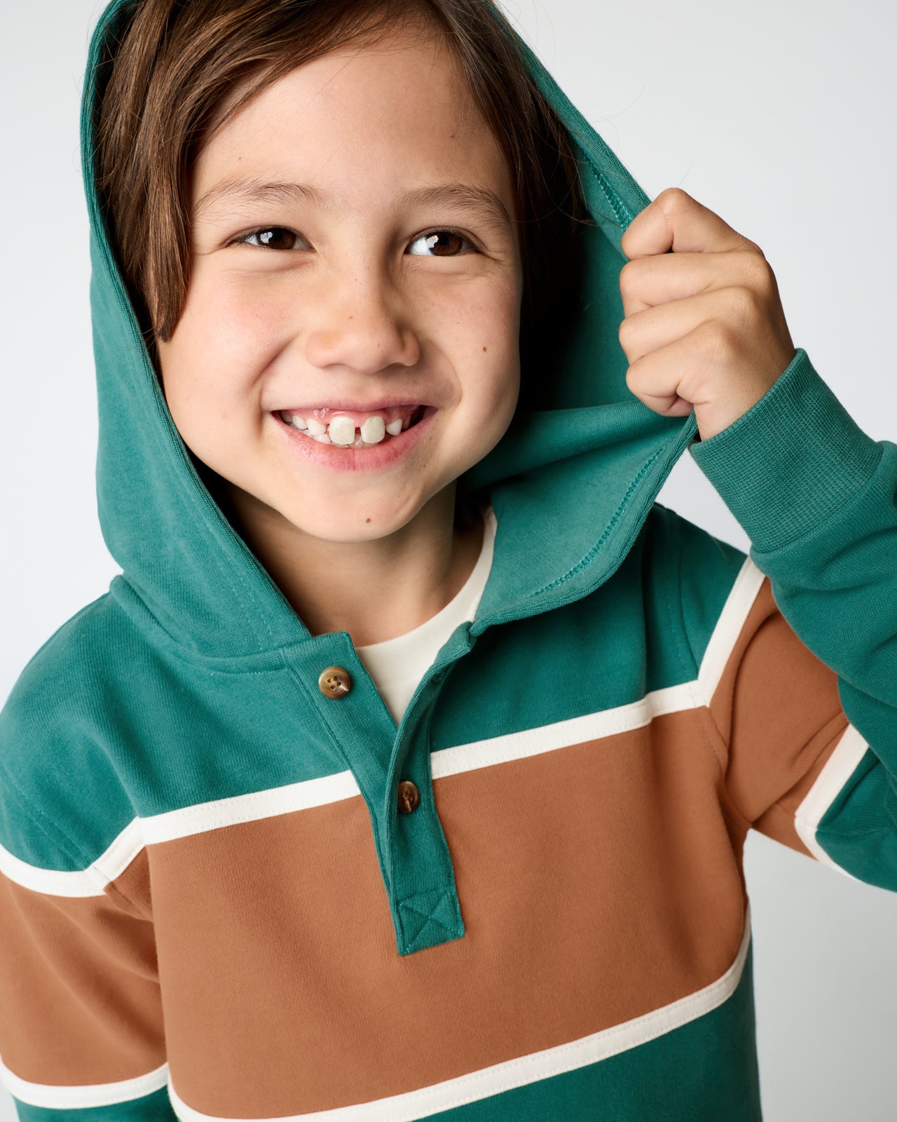 Close up of boy wearing the Emerald Isle Henley Hoodie