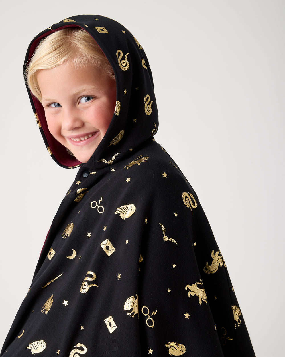 Close up of girl wearing the Harry Potter™ Spellbinding Studies Hooded Cloak