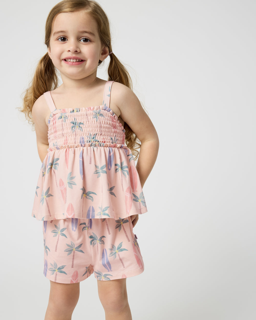 Close up of girl wearing the Palm Dunes Smocked Tank & Shorts Set