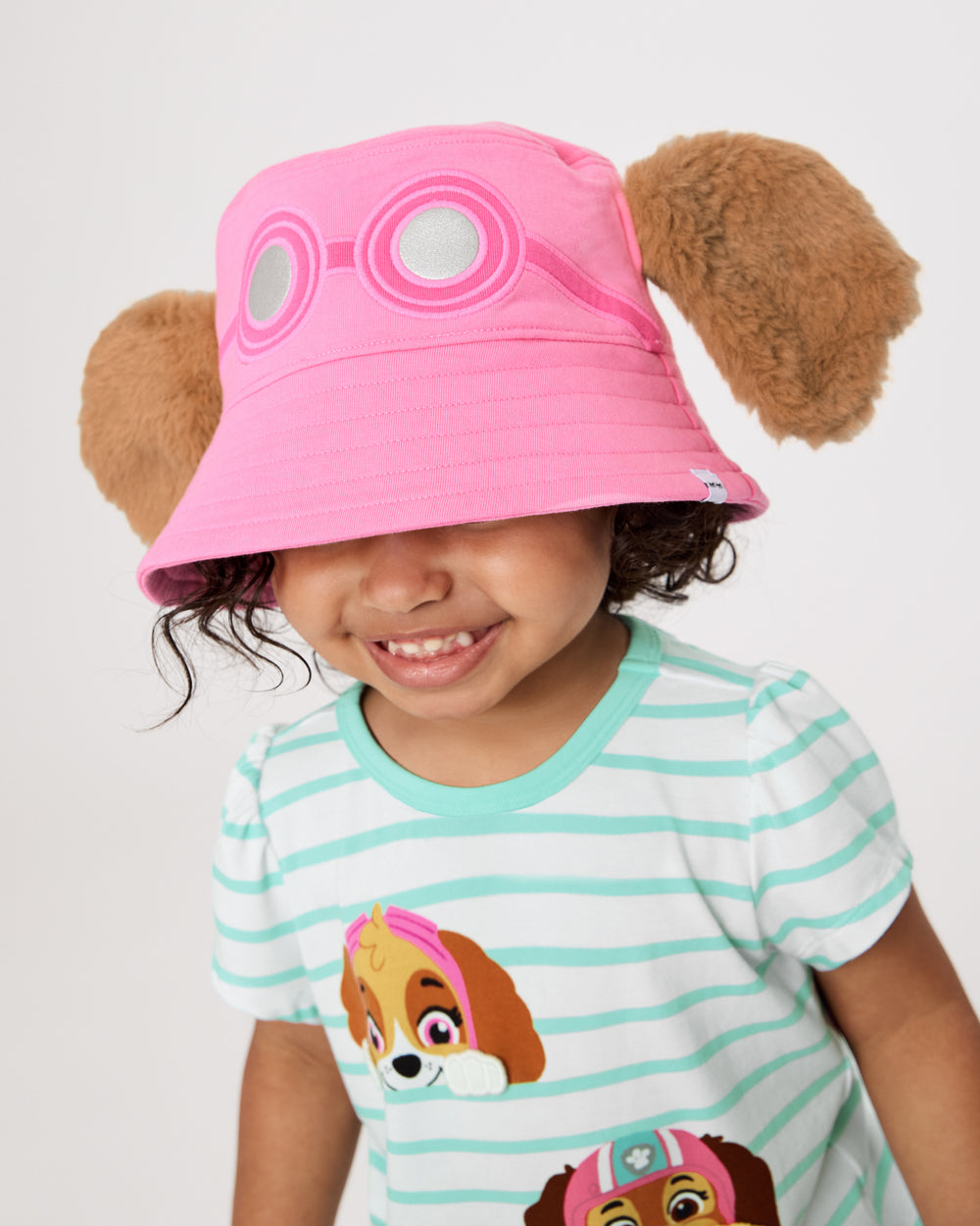 Girl wearing the PAW Patrol Skye Bucket Hat