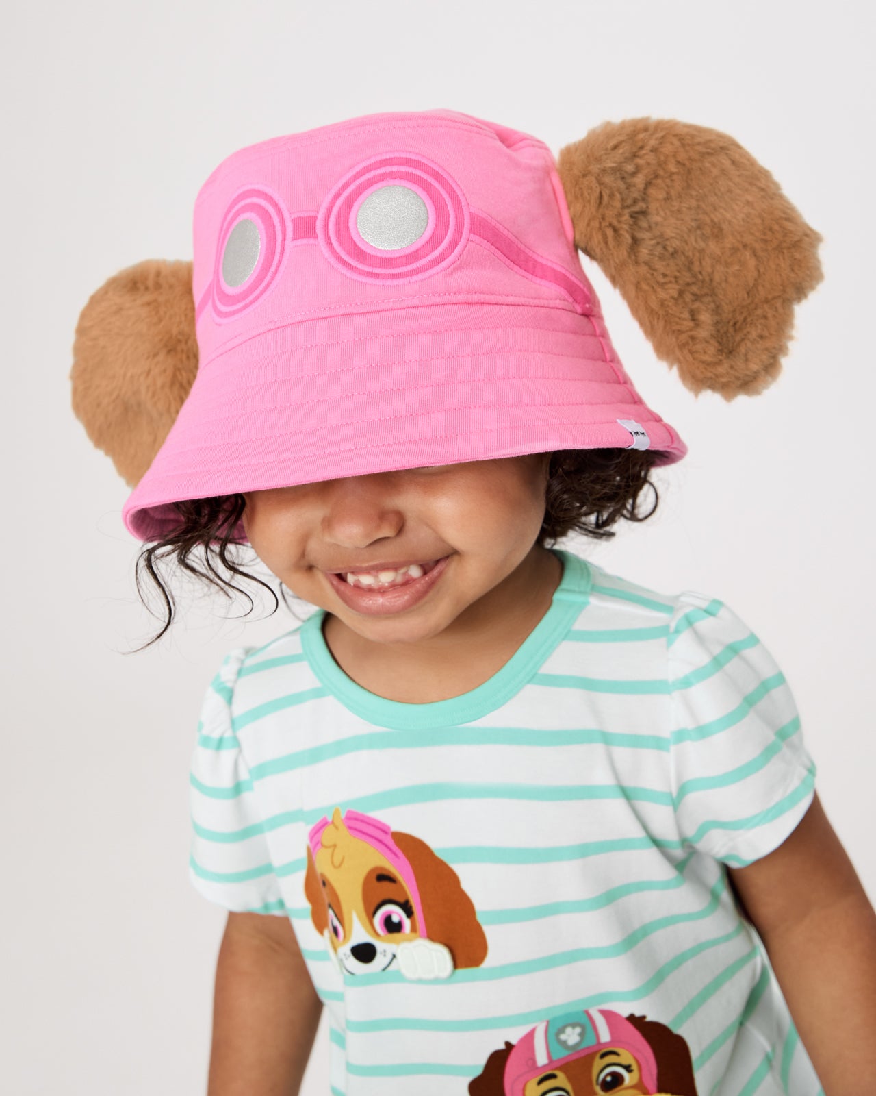 Girl wearing the PAW Patrol Skye Bucket Hat