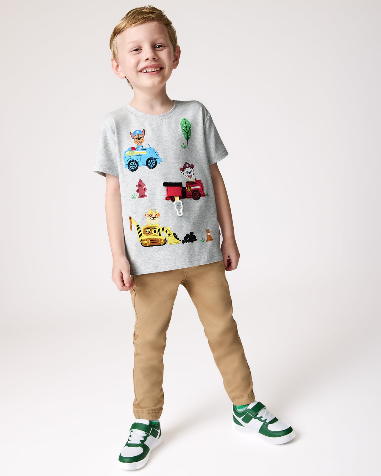 Boy wearing the PAW Patrol Rescue Ready Relaxed Tee with khaki joggers