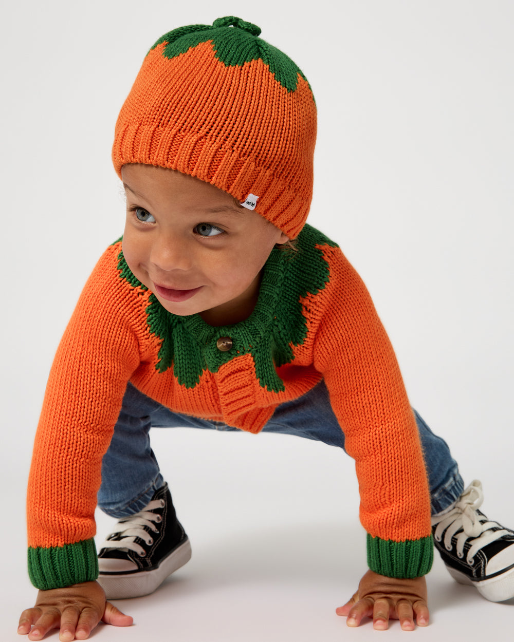 Crawling toddler wearing the Pumpkin Sweater Beanie and Cardigan 