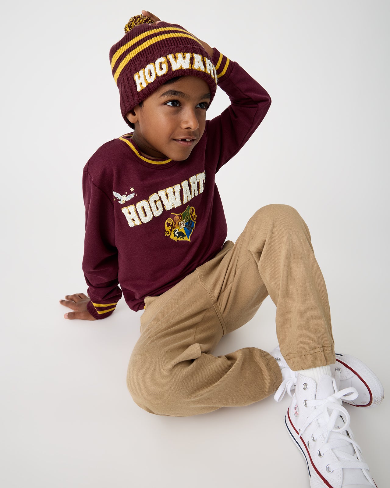 Boy wearing the Harry Potter™ Spellbinding Studies Sweater Beanie and Crewneck