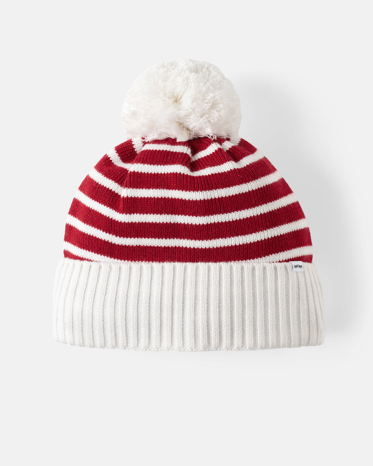A red and white striped knit beanie with a fluffy white pom-pom on top and a ribbed white cuff, photographed against a clean white background.