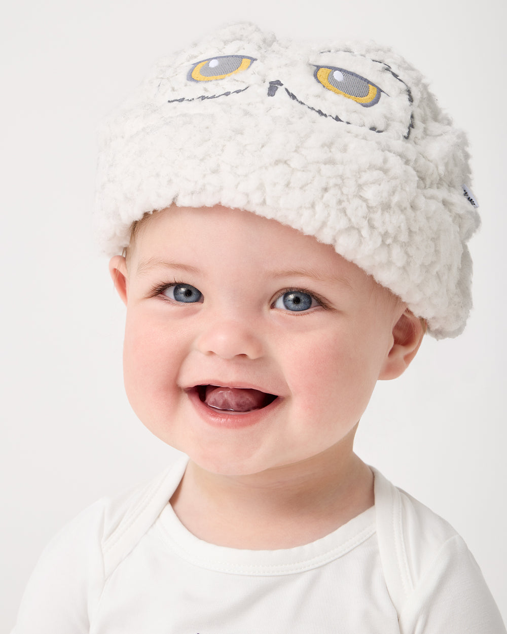Close up of baby wearing the Harry Potter™ Hedwig Sweater Beanie
