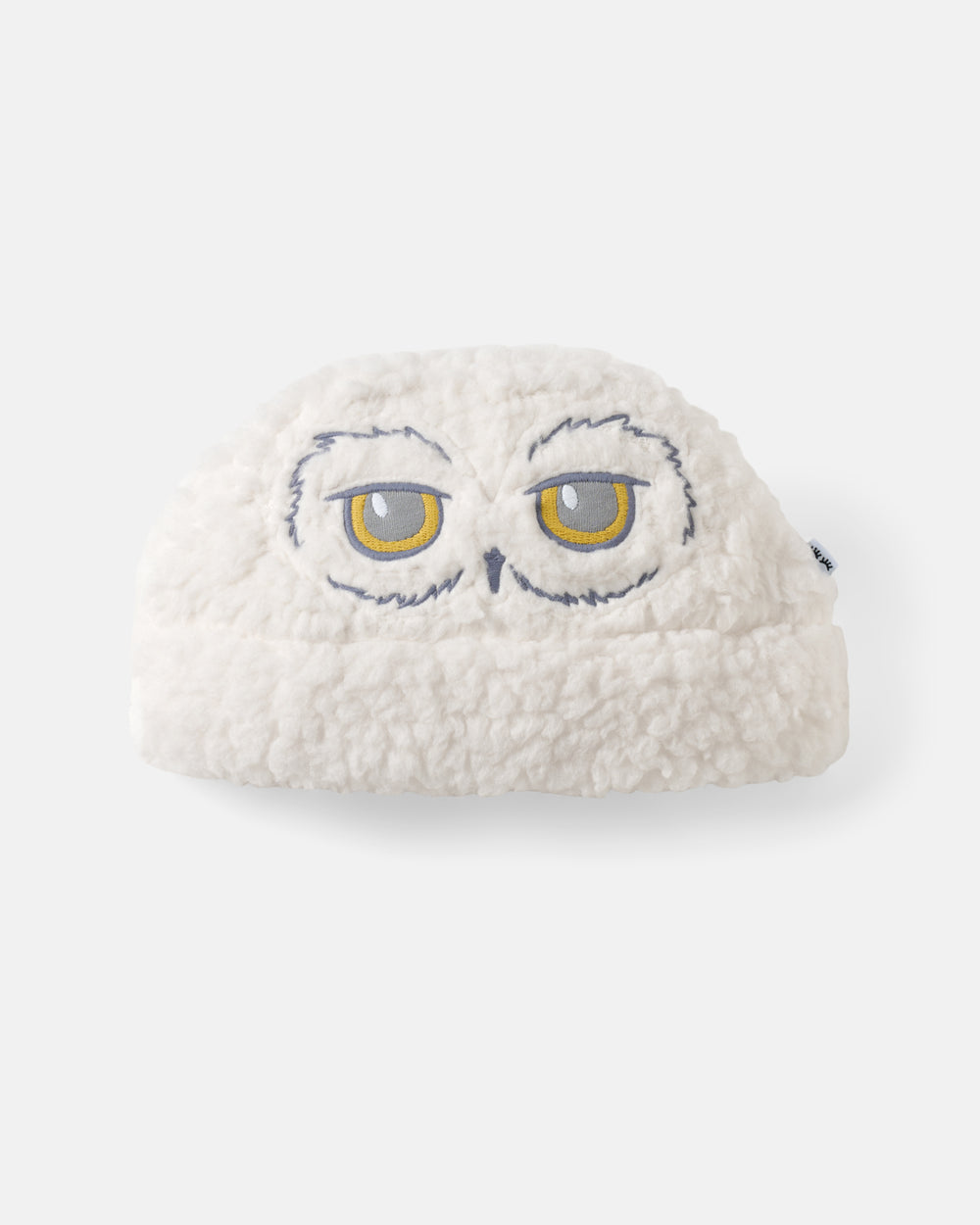 Flat lay of the Harry Potter™ Hedwig Sweater Beanie