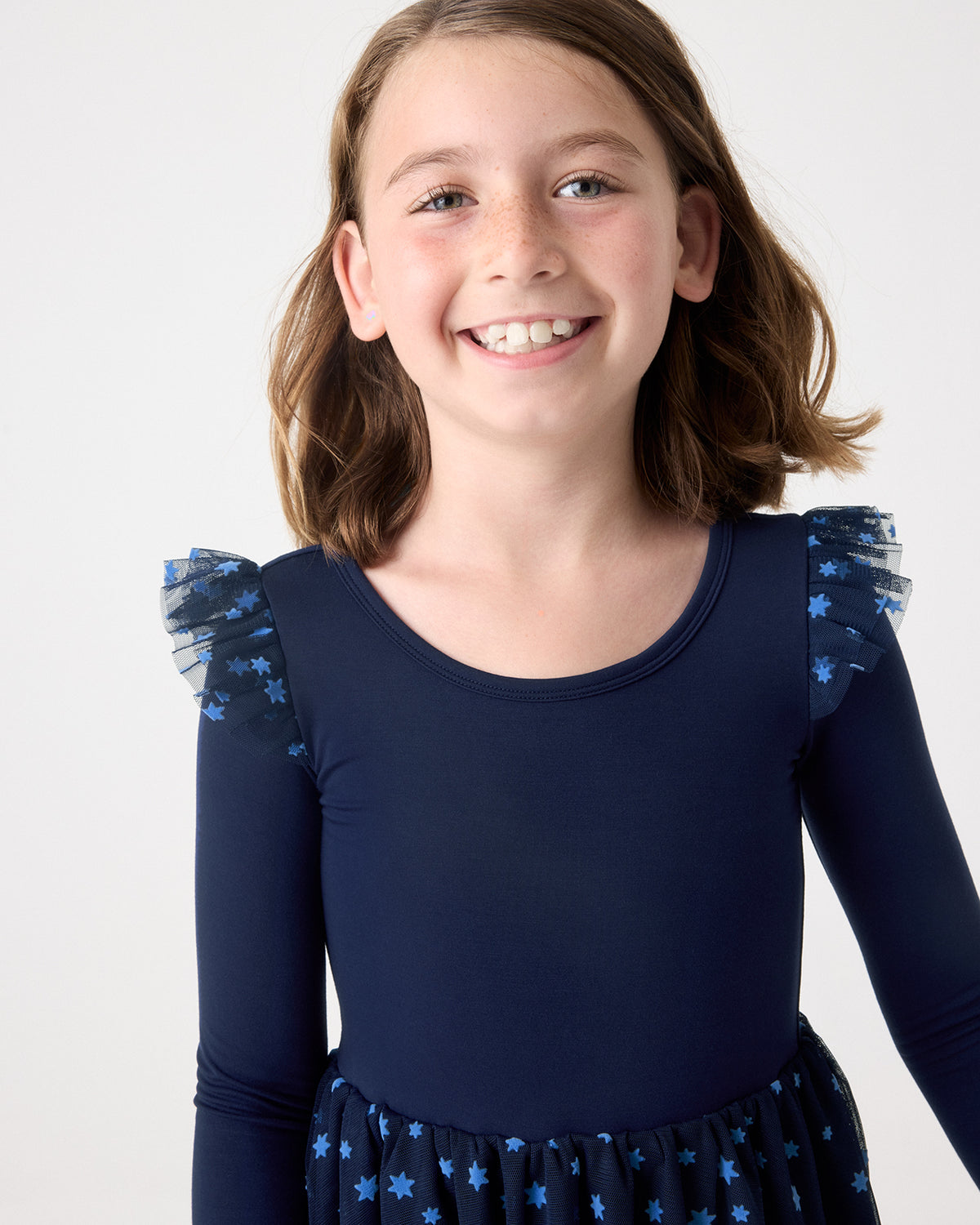 Close up of girl wearing the Hanukkah Night Sky Flutter Tutu Dress