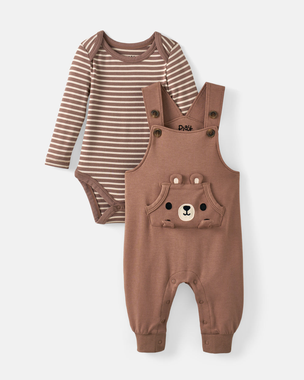 A two-piece baby clothing set featuring a long-sleeve bodysuit with brown and beige horizontal stripes and matching brown overalls with a bear face patch on the chest, displayed on a light gray background.
