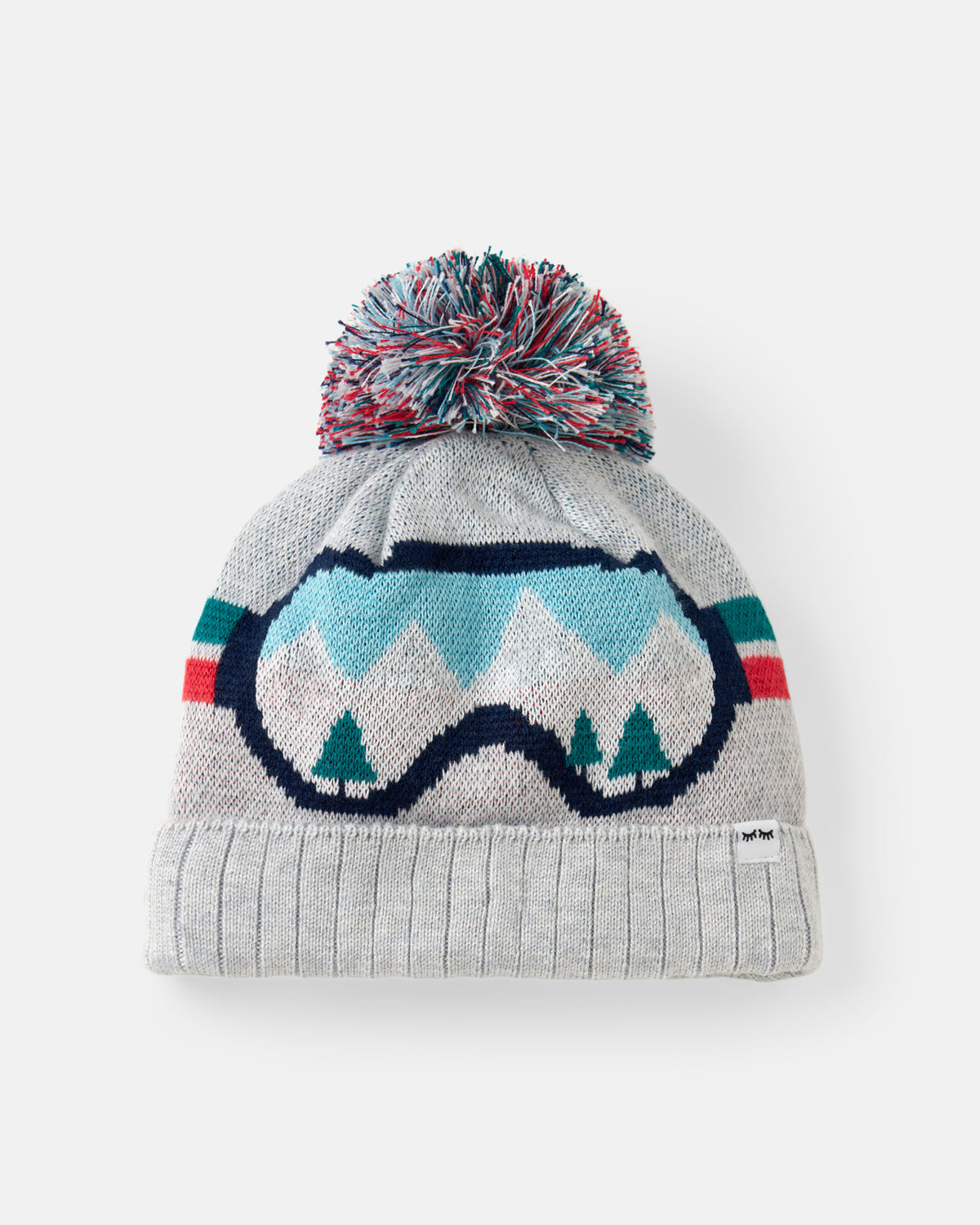 A light gray knit beanie with a multicolor pom-pom and a large ski goggles graphic in light blue, navy, and green on the front, photographed against a clean white background.