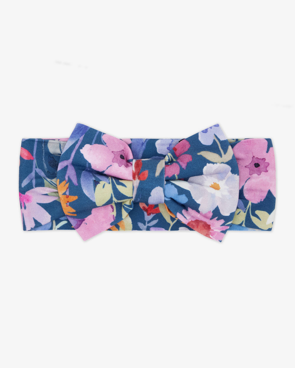 Flat lay of the Dusk Blooms Luxe Bow Headband