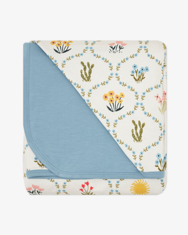 Flat lay of the Desert Meadow Large Cloud Blanket®