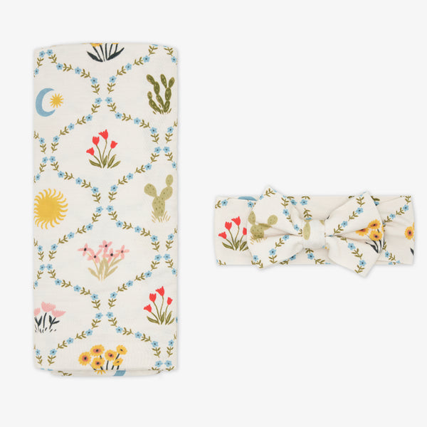 Flat lay of the Desert Meadow Swaddle & Luxe Bow Headband Set