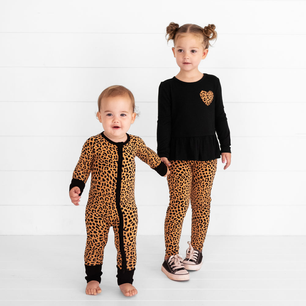 Two children wearing matching Classic Leopard outfits