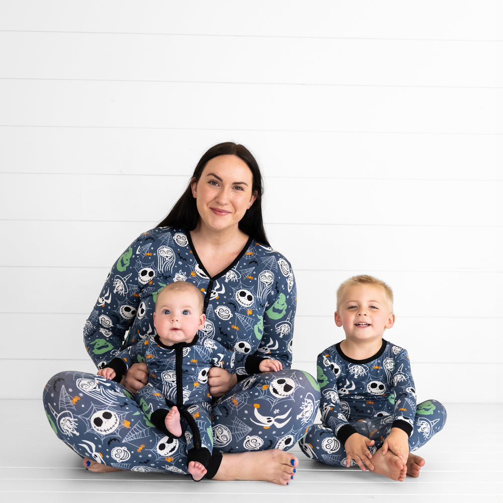 Mother and her two children wearing matching Jack & Crew printed pajama sets in women's and children's styles. Children are wearing two piece and zippy styles.