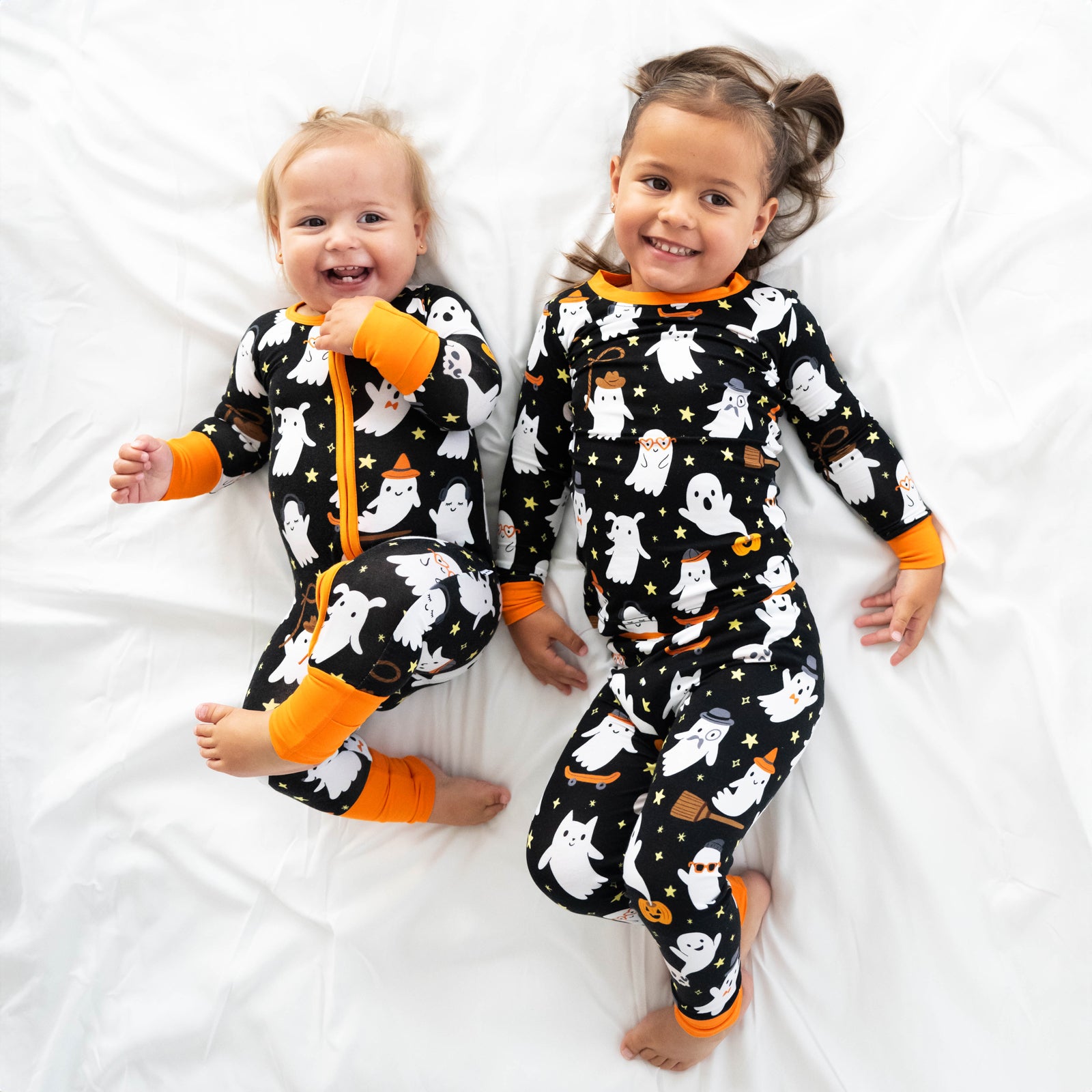 two children wearing Friendly Ghost printed pj sets in zippy and two piece styles