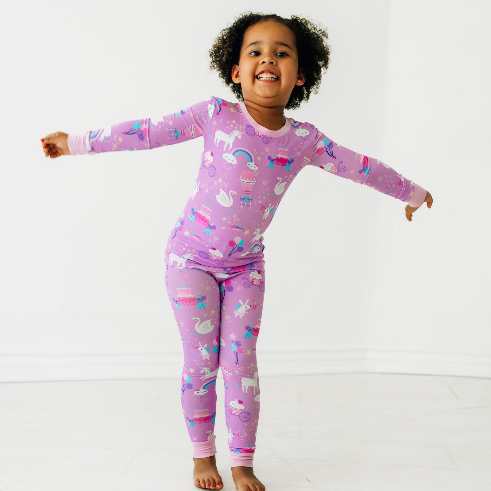 Child playing wearing a Magical Birthday two piece pj set