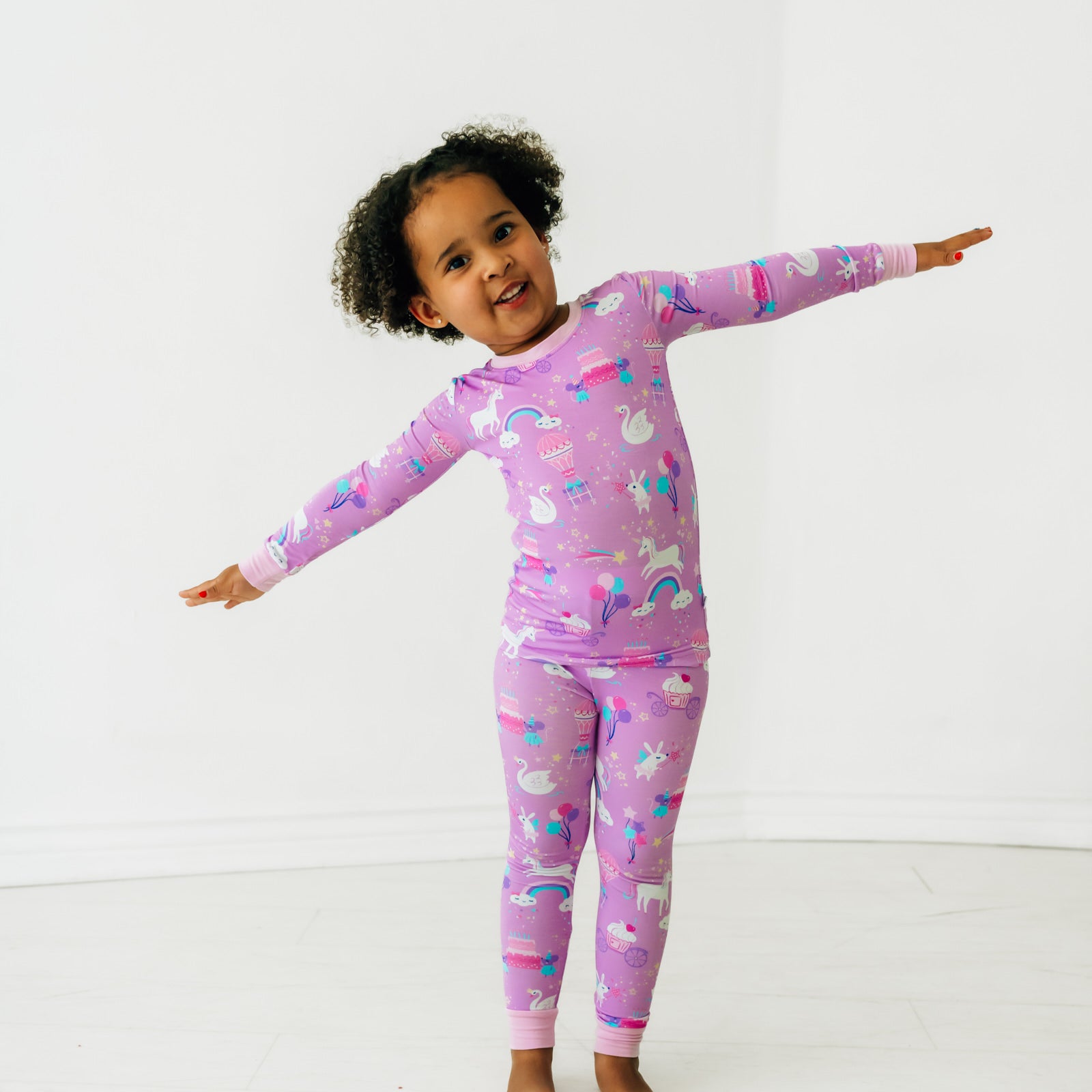 Alternate image of a child playing wearing a Magical Birthday two piece pj set