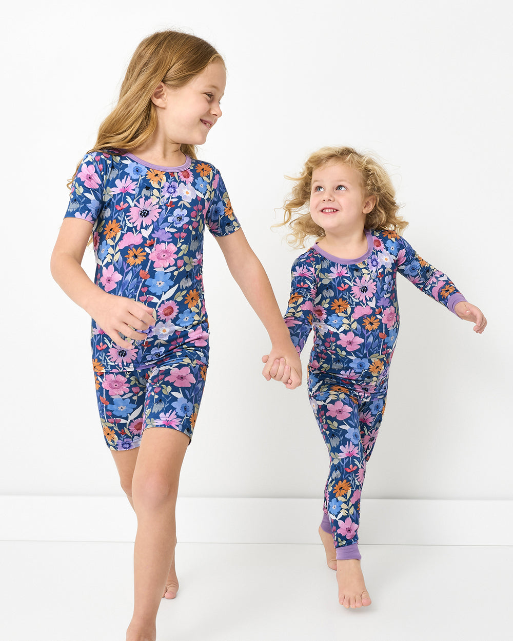 Two girls wearing matching Dusk Blooms Two-Piece Short Pajama Sets