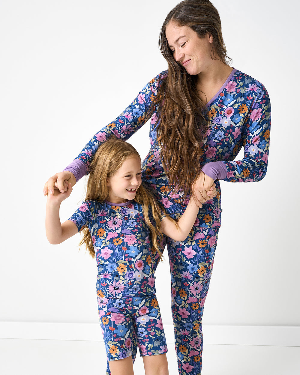 Mother and daughter wearing matching Dusk Blooms bamboo pajamas