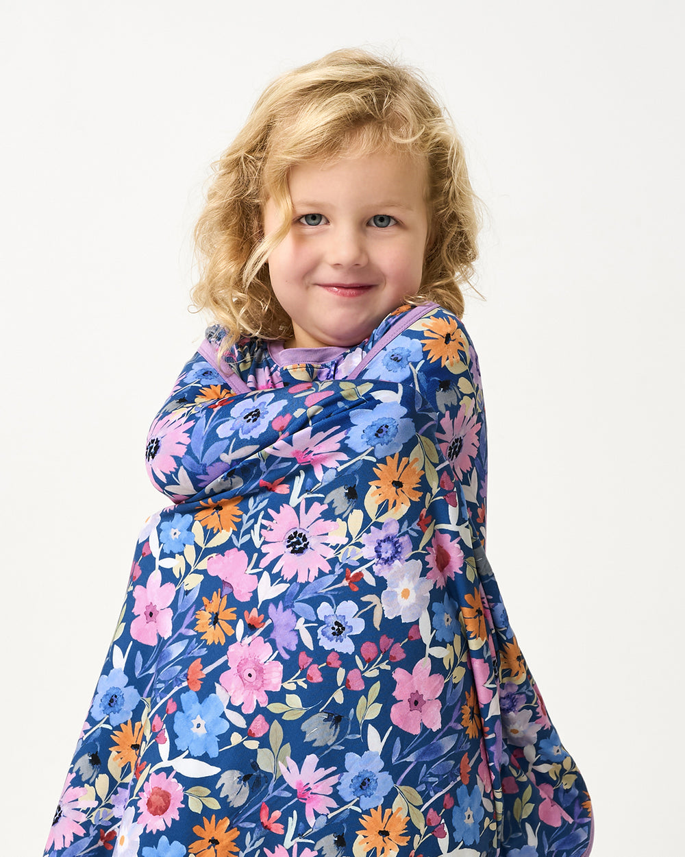 Standing girl wrapped in the Dusk Blooms Large Cloud Blanket®
