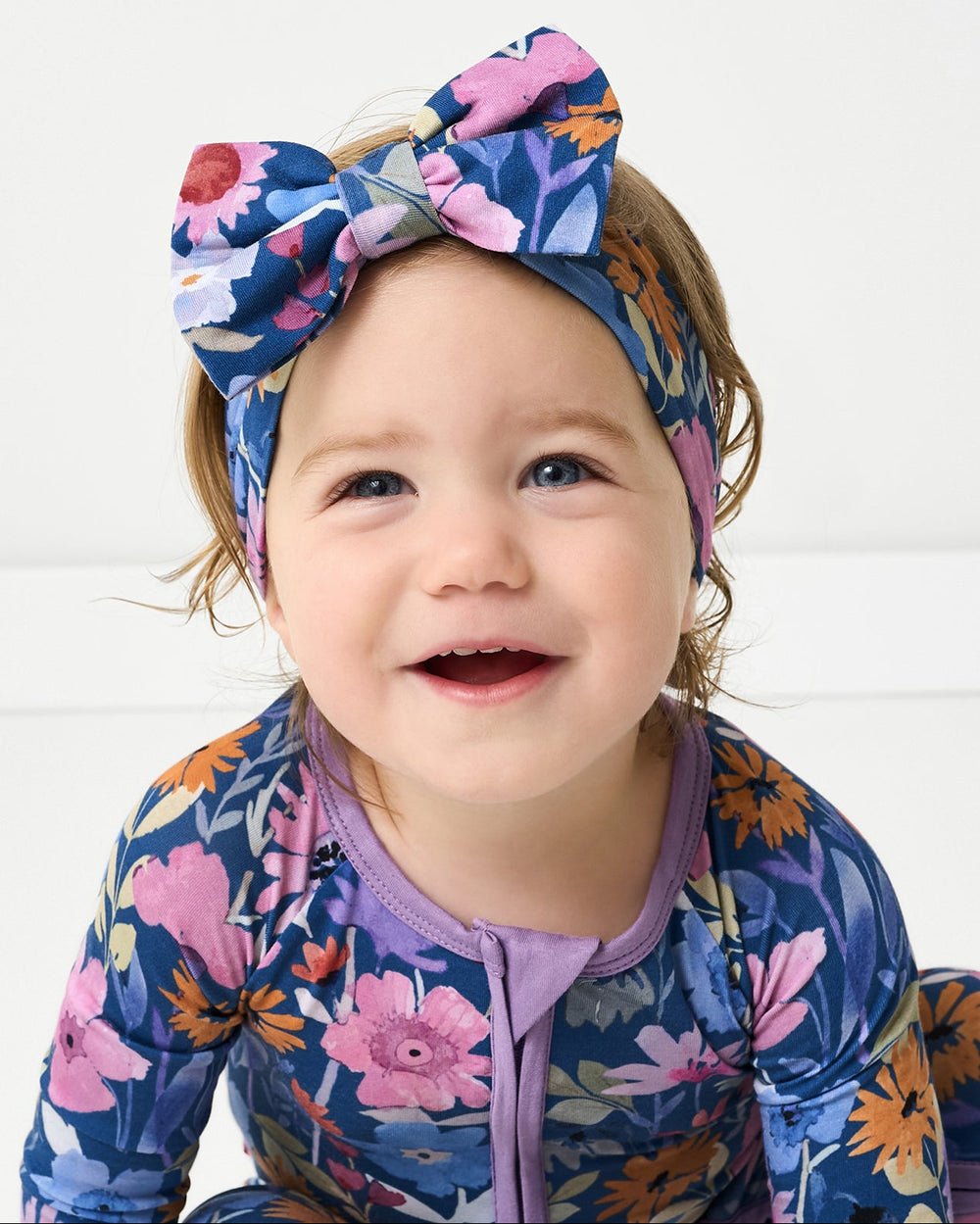 Child wearing the Dusk Blooms Luxe Bow Headband