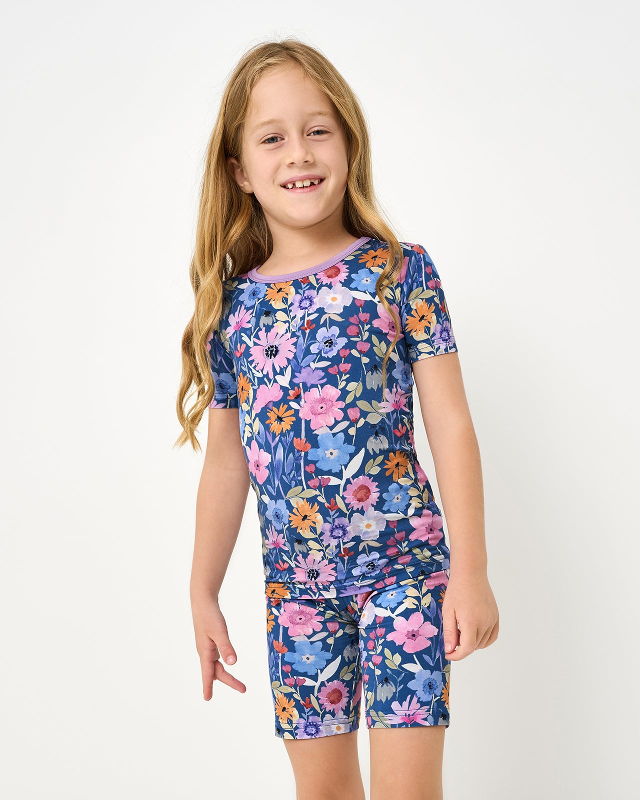 Close up of girl wearing the Dusk Blooms Two-Piece Short Sleeve & Shorts Pajama Set
