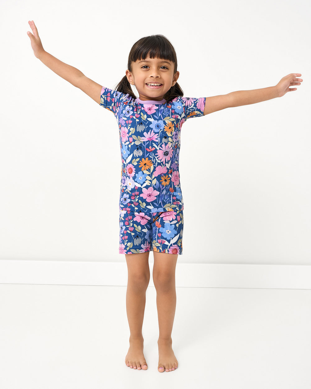 Posing girl wearing the Dusk Blooms Two-Piece Short Sleeve & Shorts Pajama Set